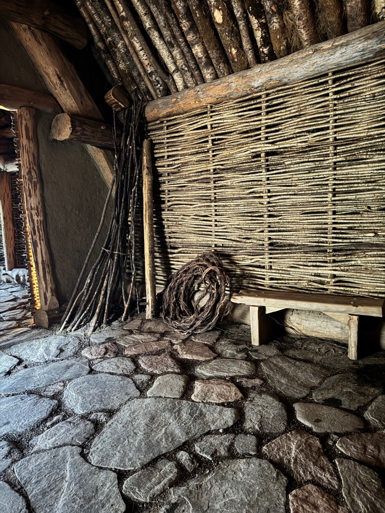 Inside view of stone, wood work and wall weaving